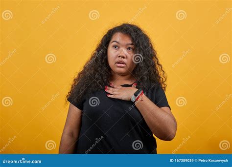 Shocked Young Woman With Overweight Keeping Hand On Chest Looking At Camera Stock Image Image
