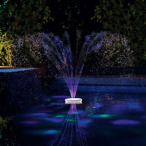 The Floating Lighted Pool Fountain Hammacher Schlemmer