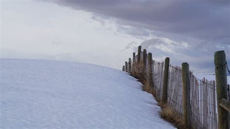A Large Drift Of Snow On A Snow Fence In Wyoming Stock Photo Image