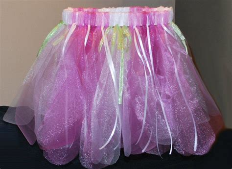 Pink And Green Tulle Skirt Sitting On Top Of A Table