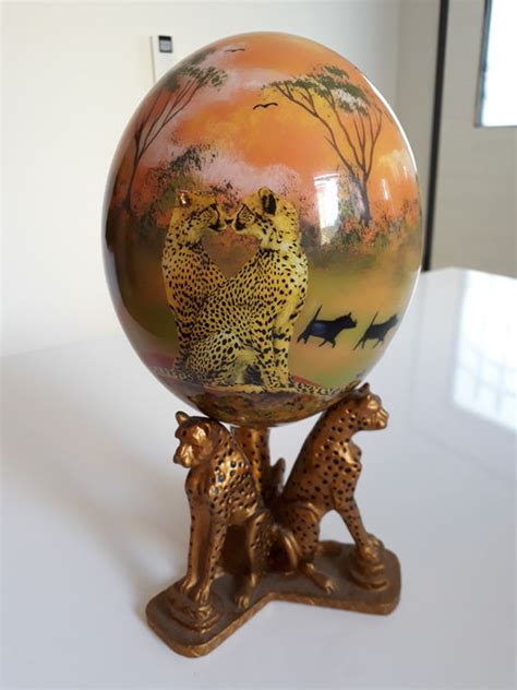 Free shipping available on many items. Decorated ostrich egg depicting a sunset in the savannah with cheetahs - Signed, with stand ...