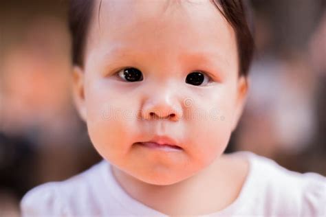 Bright Close Up Of A Baby Making A Serious Face Stock Image Image Of