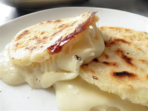 Delicious Colombian Arepas Filled With Mozzarella Cheese Arepas Arepas Recipe Colombian Arepas