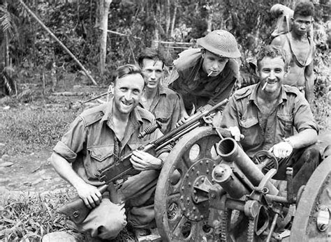 Australian Soldiers Pose With A Captured Japanese 70mm Type 92 Howitzer