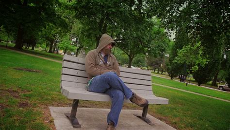 A Sad Man Sits Alone On A Park Bench Stock Footage Video 3959047