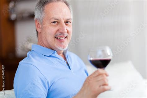 Man Holding A Glass Of Red Wine Stock Photo Adobe Stock