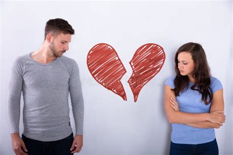 Broken Red Heart Between Sad Couple Stock Image Image Of Couple Male