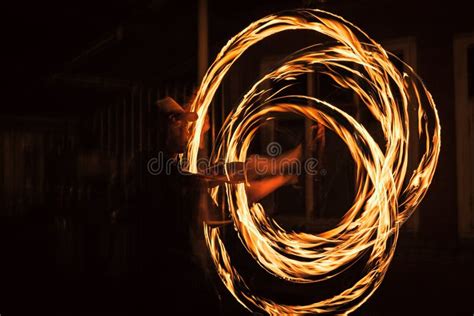 Spinning Fire Dancer Performing Burning Fire Poi Dance Stock Photo