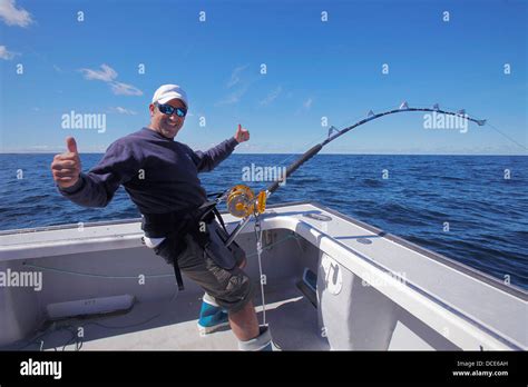 Man On A Boat Fishing In The Atlantic Ocean Prince Edward Island Canada Stock Photo Alamy