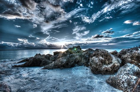 3d Photography Of Beach Rocks Under Clouds Transformation During