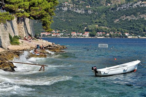 sunning and swimming on eastern shore in korčula croatia encircle photos