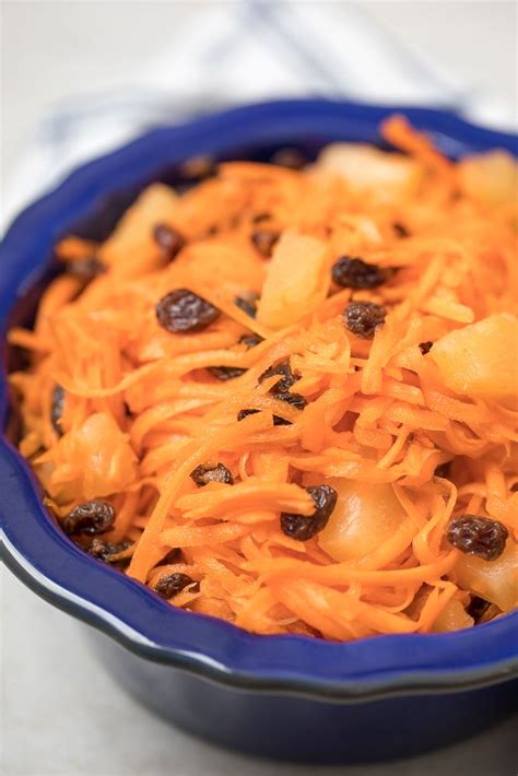 Shredded Carrots Raisins And Pineapple Are Tossed Together With A