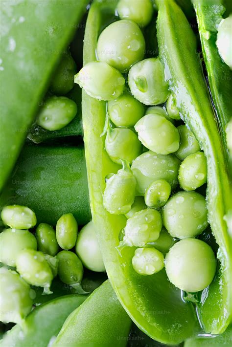 A Close Up Of Peas And Pea Pods Photo Pea Image On Unsplash