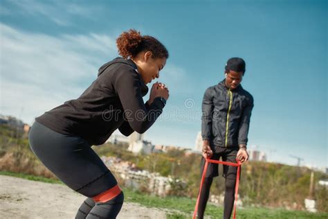 Young Athletic African Fitness Couple In Sportswear Exercising Together