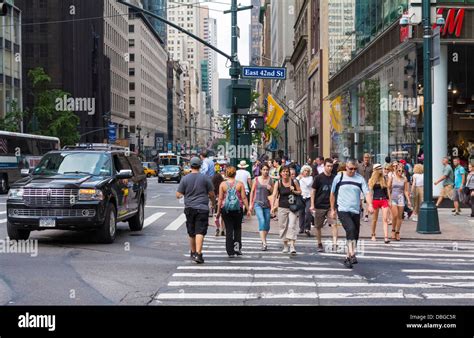 Manhattan New York Street Scene People Walking Across A Downtown