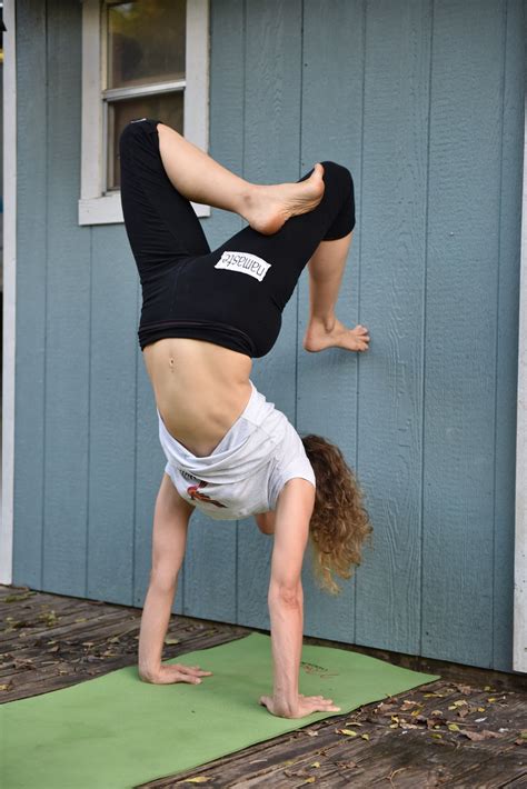 How To Yoga Scorpion Handstand Vrschikasana Yoga Current