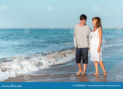 Mother And Son Walking And Enjoying The Beach Stock Photo Image Of
