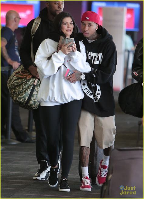 kylie jenner gets a big kiss from tyga at the airport photo 994491 photo gallery just