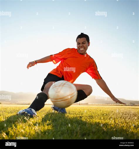 Soccer Player Kicking The Ball Stock Photo Alamy