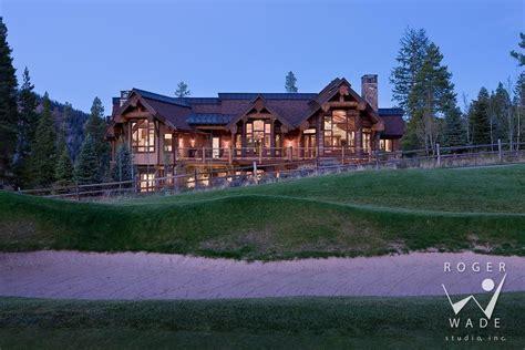 Log Home Photo Rear Elevation At Twilight From Golf Course