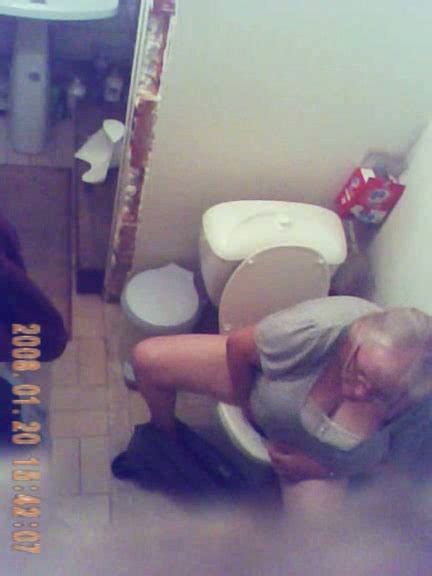 horny granny gets caught on tape by me when peeing in the toilet room video