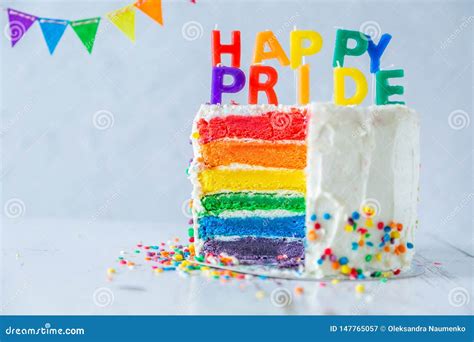 happy pride day rainbow layered cake with candles tolerance and equality for lgbt community