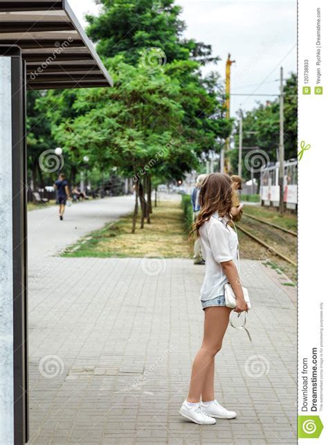 Girl Is Standing At The Bus Stop Stock Image Image Of Adult Stop