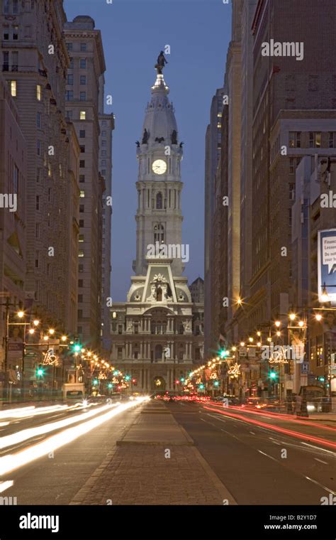 William Penn Statue On The Top Of City Hall At Dusk And Streaked Car