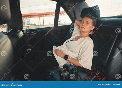 Woman Is Sitting In The Back Seat Of The Car Stock Image Image Of Driving Knees 126859185