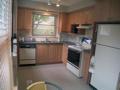In both cases, the existing cabinets remain intact. Refinishing Veneer Kitchen Cabinets | eHow