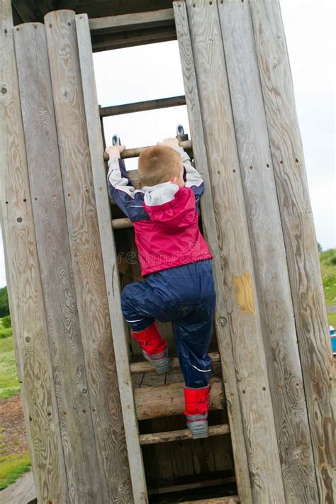 Little Boy Climbing A Ladder Stock Photo Image Of Frame Wellington