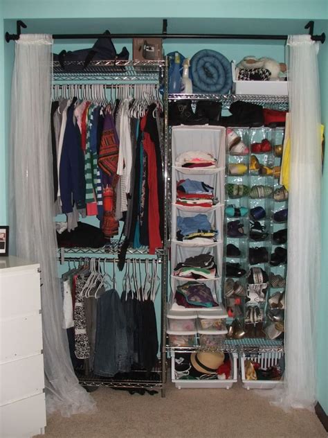 An Organized Closet With Clothes Shoes And Other Items In It S Storage Area
