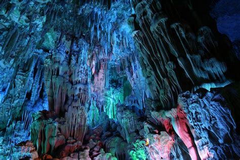 23 Of The Worlds Most Insane Caves That You Can Explore Pics Photo Tour Reed Flute Cave Cave