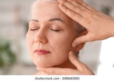 Mature Woman Receiving Face Massage Beauty Stock Photo 2088683083