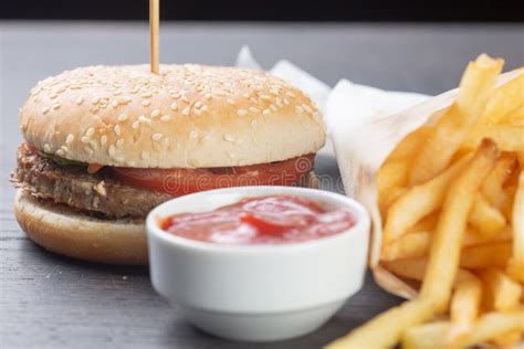 Cheeseburger With Beef Patty With French Fries And Ketchup Stock Image