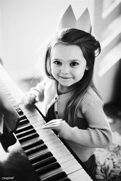 Little Caucasian Girl Playing Piano Premium Image By