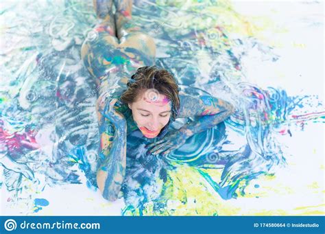Top View Of A Naked Woman In A Spray Of Paint A Girl Without Clothes
