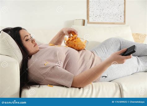 Lazy Woman Sitting In Armchair Eating Pop Corn Isolated Over White Royalty Free Stock