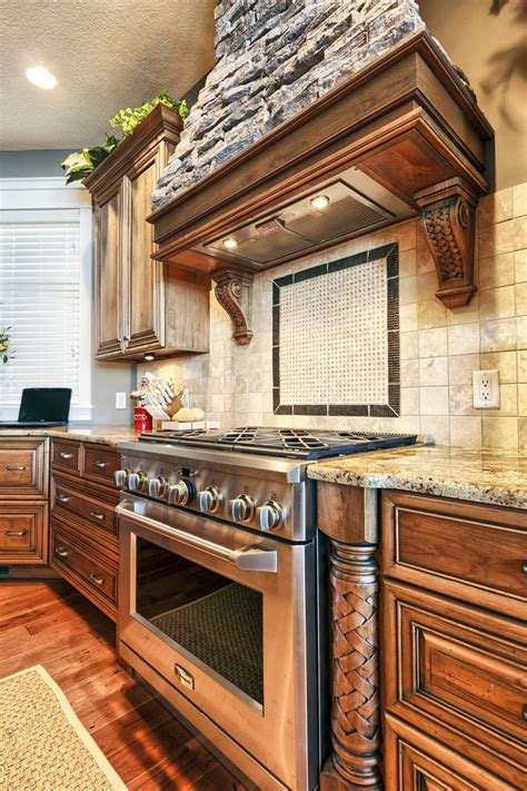 Our vast array of german kitchens feature customizable design solutions that offer roughly 2,000 color options, and a. Stacked Stone Range Hood | High end kitchen cabinets, High ...