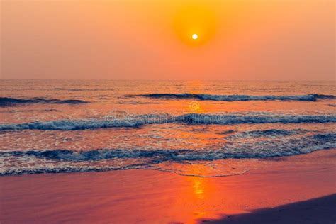 Tropical Sandy Beach Sea View During A Colorful Sunset Stock Image