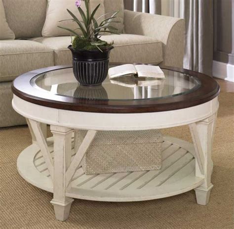 Brown/black medium round wood coffee table with storage shelf. Wood Coffee Table with Glass Insert Top Ideas