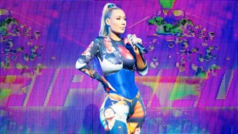 Iggy Azalea Wears A Bizarre Catsuit Covered With Faces Of Al Pacino For Performance Photos