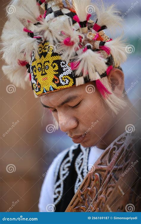 A Young Man Wearing Beautiful Traditional Dayak Hat From Kalimantan