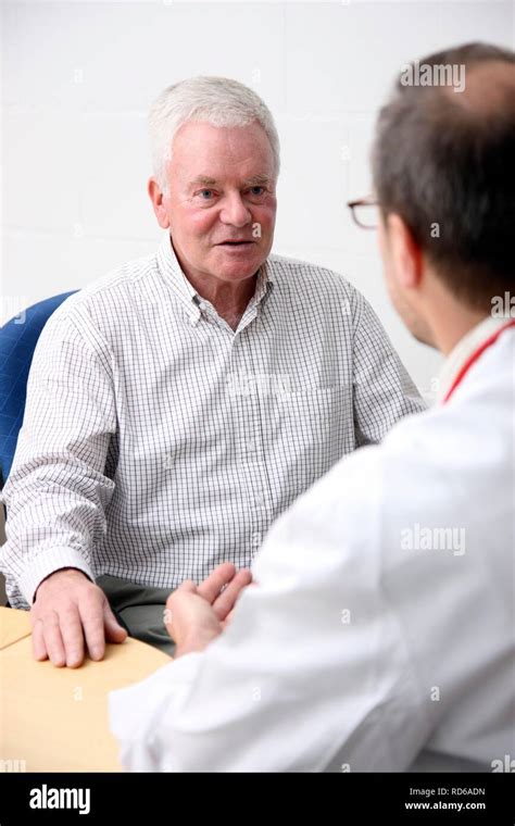 Man Senior About 70 Years Old Having A Conversation With His Doctor