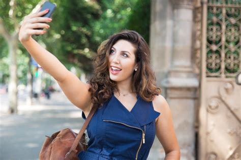 Free Photo Cheerful Young Woman Taking Selfie Outdoors
