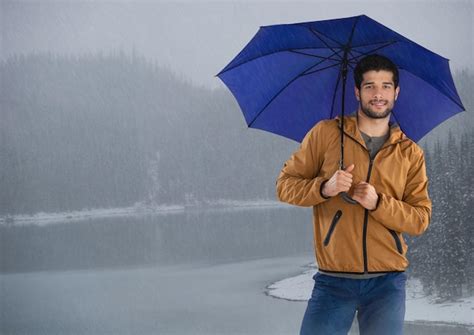Premium Photo Man With Umbrella Over Icy Lake
