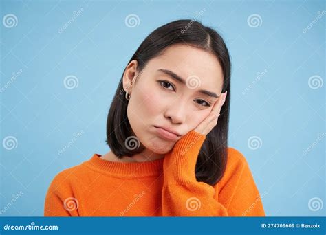 Close Up Of Sad And Gloomy Japanese Girl Sulking And Looking Upset