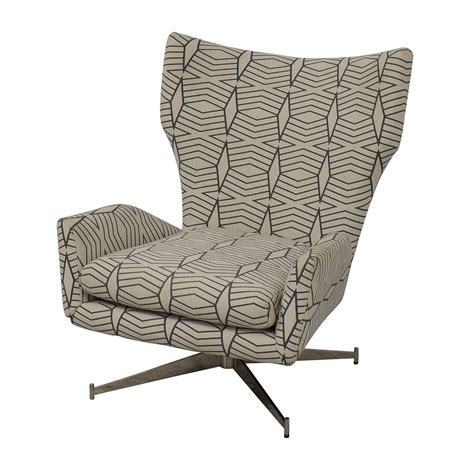 Its cushioned back, gently sloped arms and matching ottoman (sold. 65% OFF - West Elm West Elm Swivel Armchair / Chairs