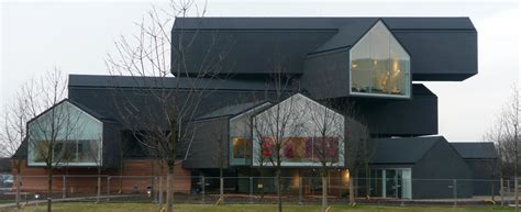 Building designed by the swiss architecture firm herzog & de meuron,. File:VitraHaus in Weil am Rhein 5.JPG