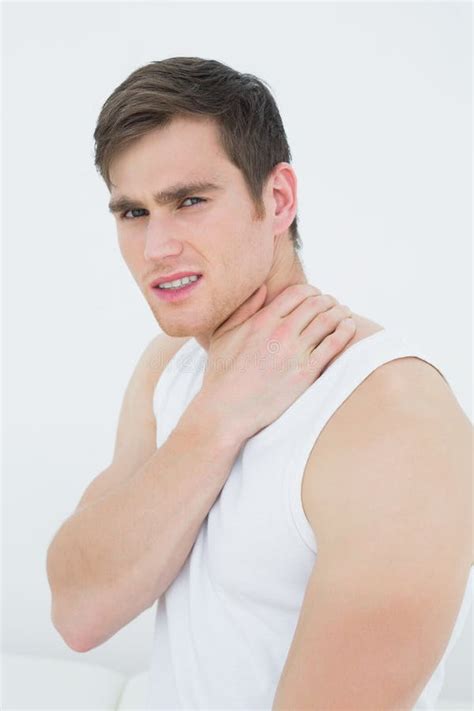 Side View Portrait Of A Young Man Suffering From Neck Pain Stock Image